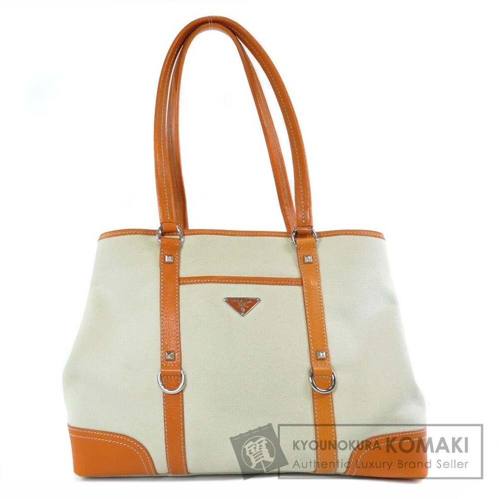 Prada beige canvas orange leather studded tote bag